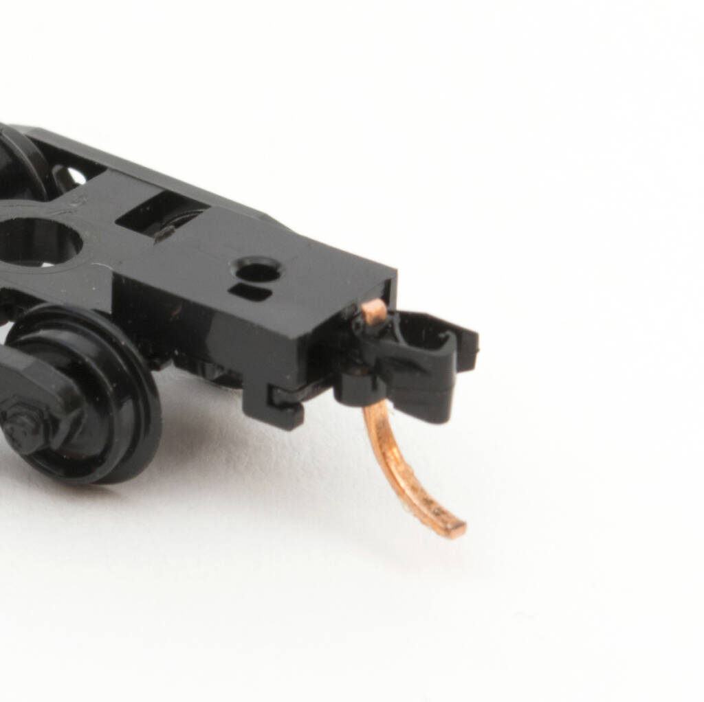 Color photo of N scale freight car truck with Micro-Trains Line Co. Magne-Matic knuckle coupler