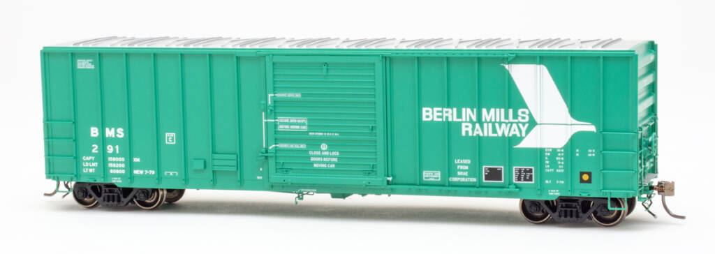Color photo jade green boxcar with silver roof and white graphics on white background