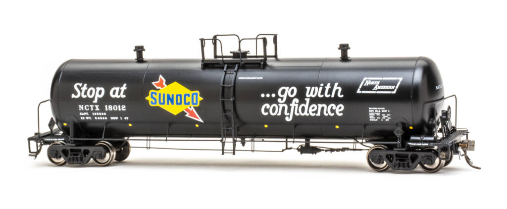 Color photo of HO scale tank car painted black with yellow, blue, red, and white graphics on white background 
