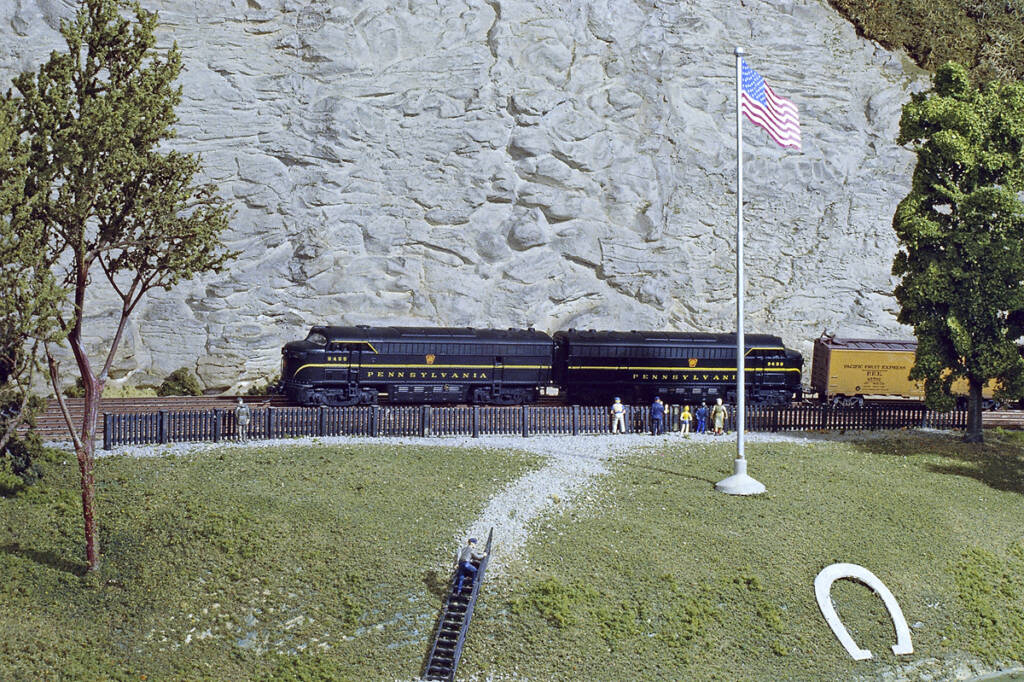 A model train with two black locomotives
