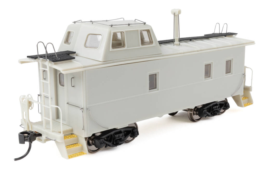 Color photo of HO scale caboose molded in gray plastic with formed wire and etched-brass detail parts. 