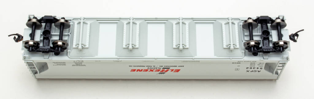 Color photo showing underbody of HO covered hopper on white background.