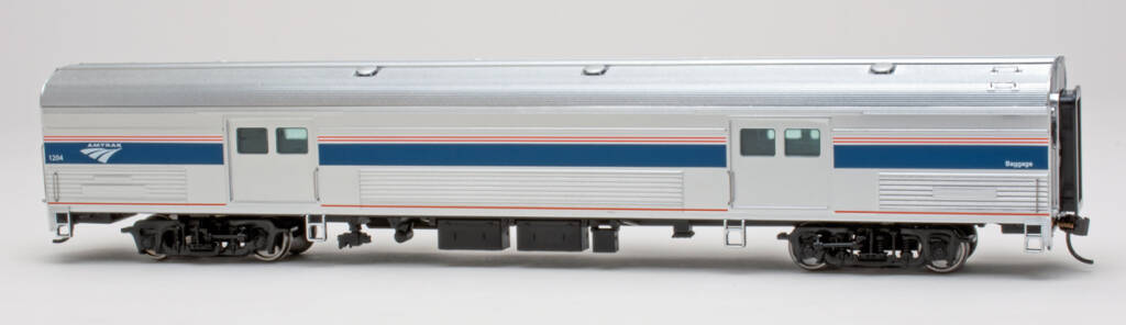 Color photo HO scale baggage car with metal finish and red, white, and blue graphics on white background