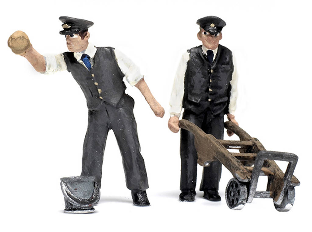 Color photo showing two scale figures in railroad uniform, one with rag and bucket and one with hand cart.