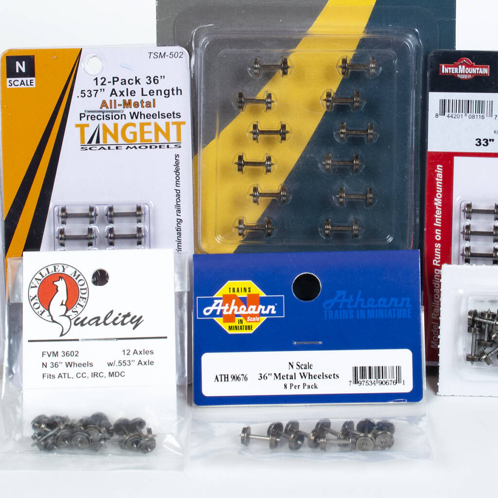 Photo showing packages of N scale metal wheelsets on white background.