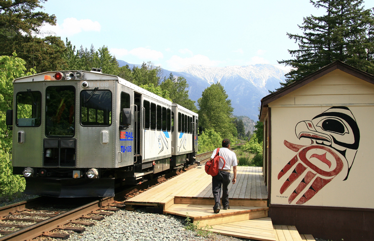 Railbuses at small remote passenger shelter