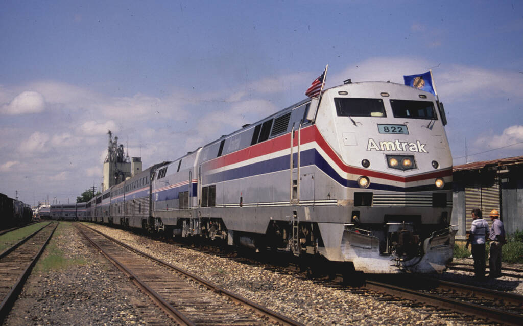 Long passenger train two locomotive and bilevel cars