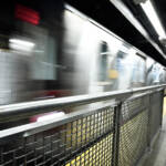 Fencing on edge of subway station platform