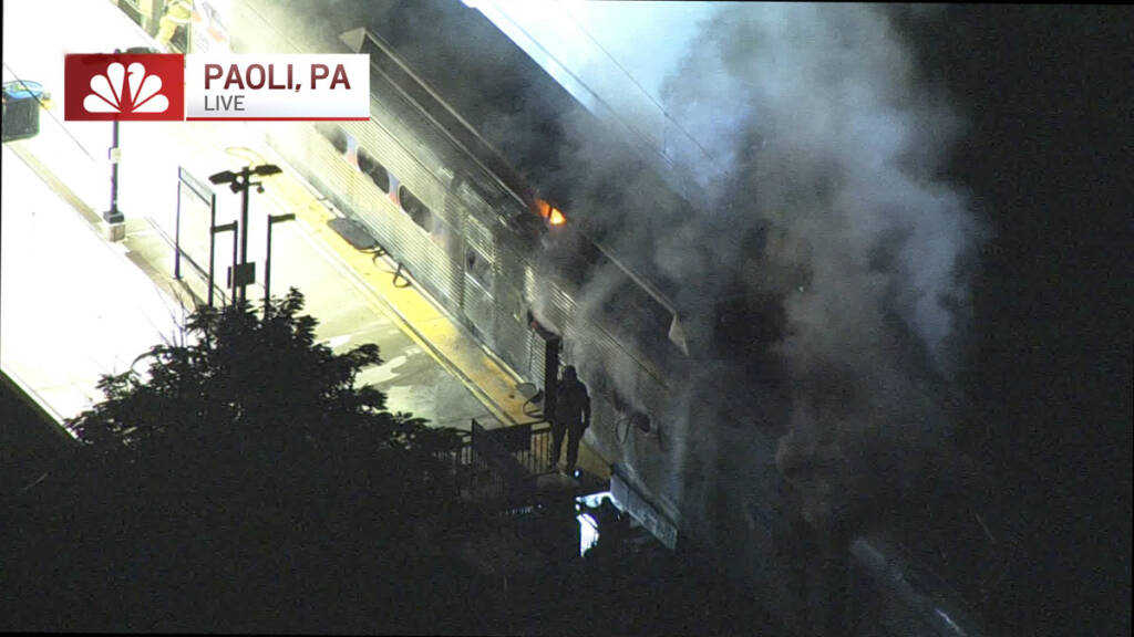 Screenshot of aerial view of SEPTA train on fire on July 22, 2025.
