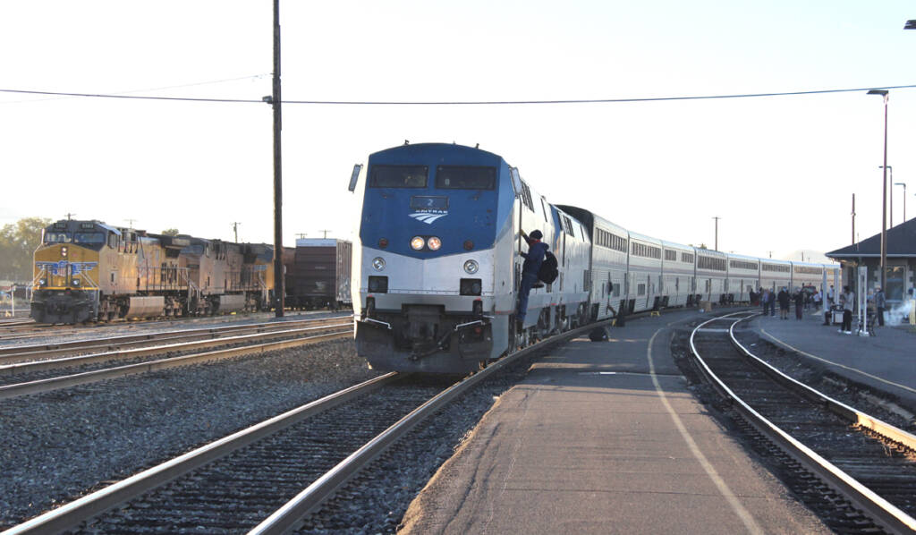 Passenger train stopped at station on curve