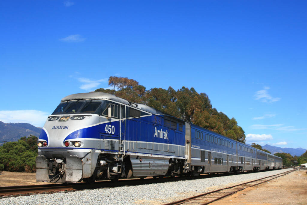 Blue and silver passenger train with bilevel equipment