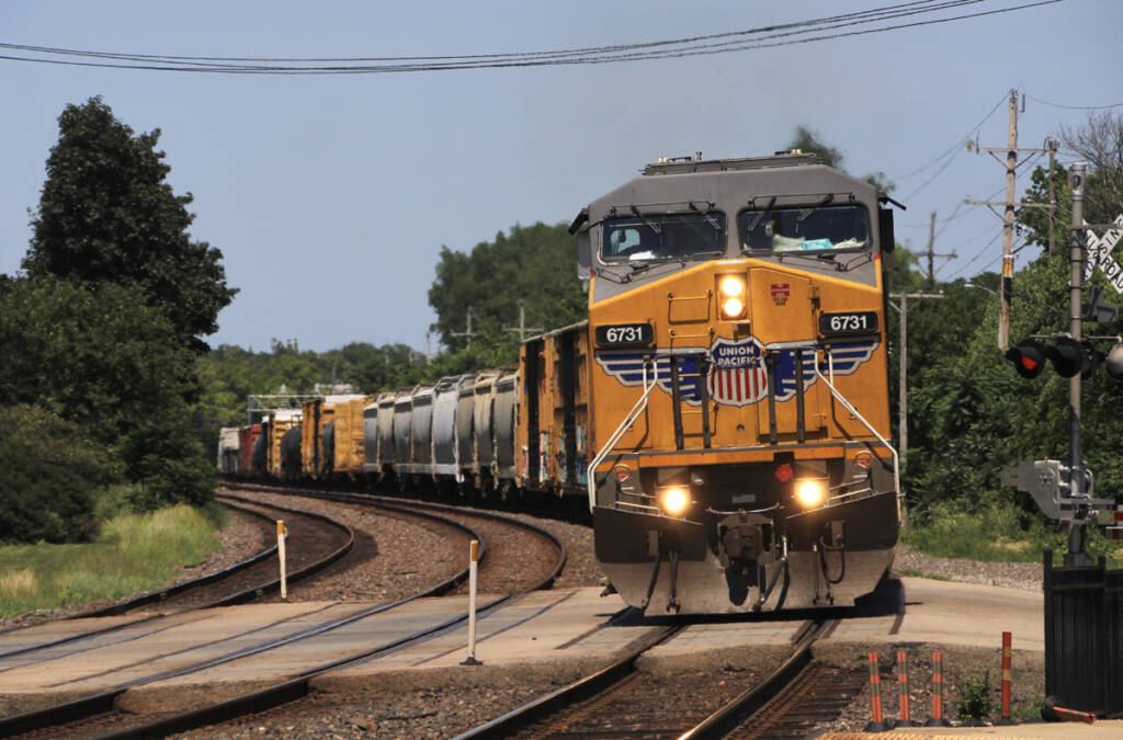Freight train with yellow locomotive