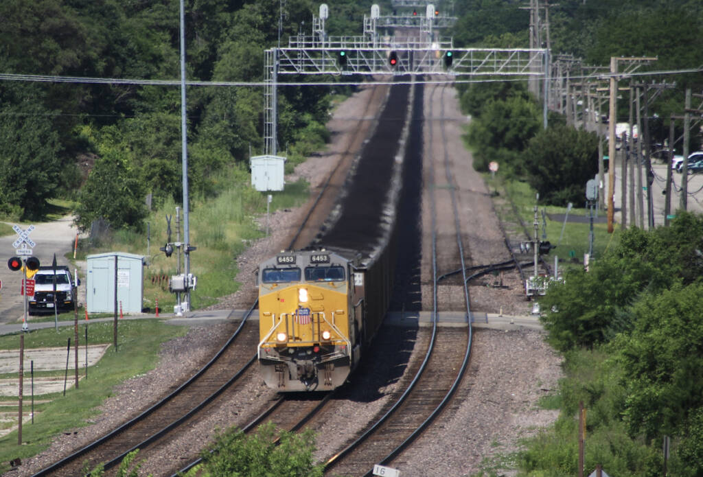 High-angle view of coal train approaching curve