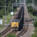 High-angle view of coal train approaching curve