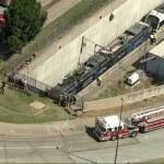 Aerial view of fire on light train at tunnel entrance