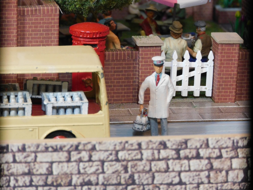 milkman figure on toy train layout