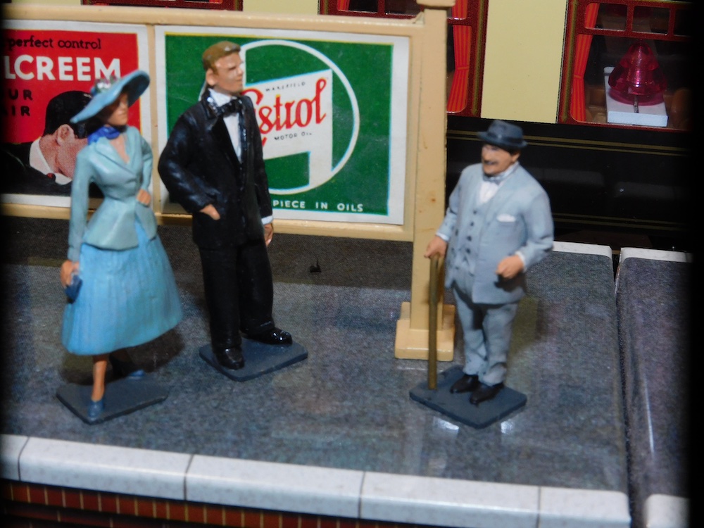 three figures toy train layout