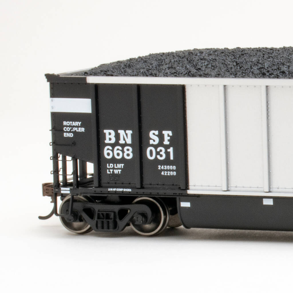 Color photo showing rotary end of HO scale bathtub coal gondola painted silver and black