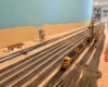 N scale yard with locomotives at a fueling station