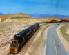 N scale diesels sit on a siding