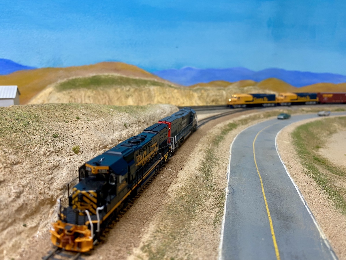 N scale diesels sit on a siding