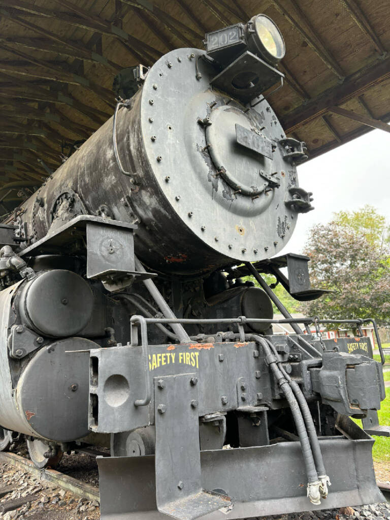 Front of black steam locomotive in a city park. Western Maryland No. 202 will remain city park,
