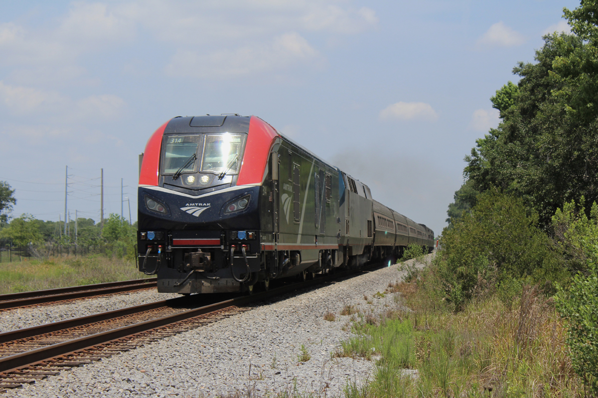 Passenger train on straight, flat track