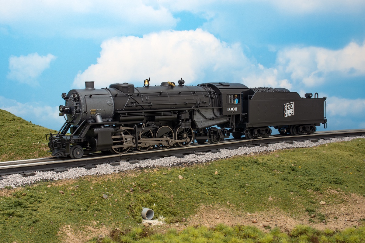 O scale steam locomotive on a layout