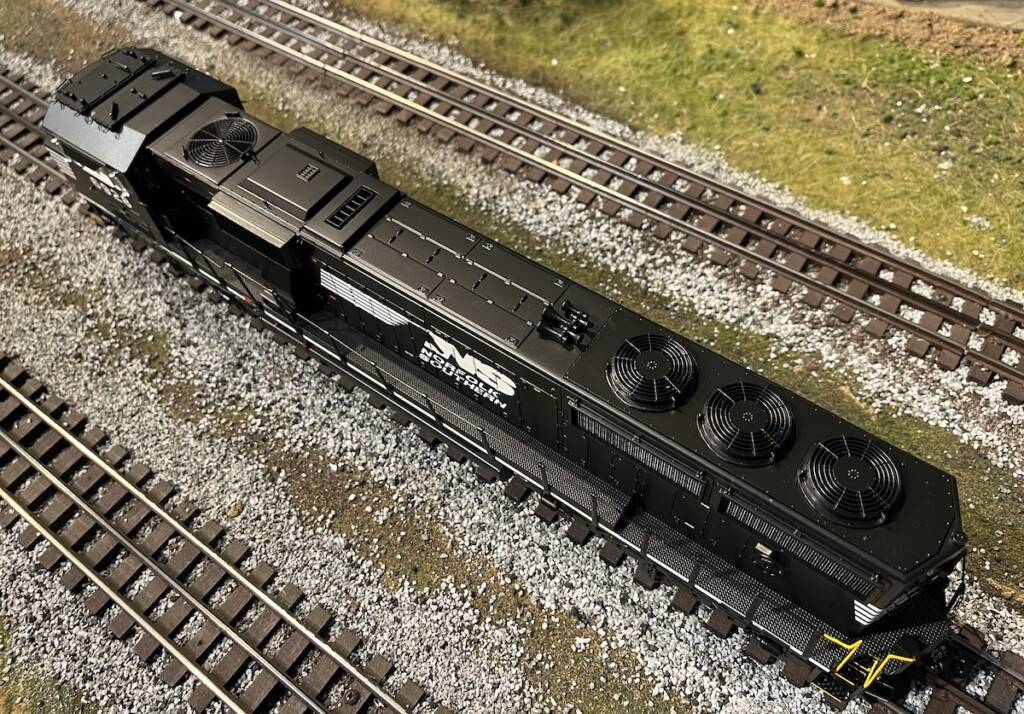 top view of black and white model locomotive