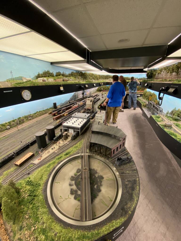 A couple of visitors admire a layout.