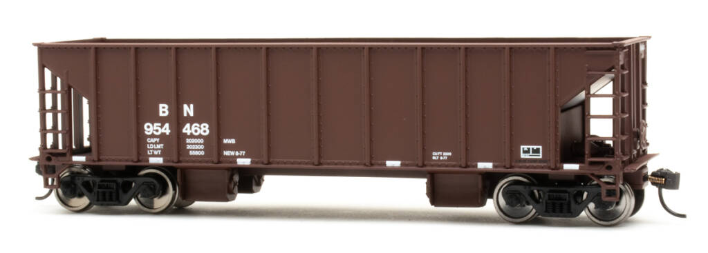 Color photo of HO scale ballast hopper painted mineral red with white lettering on white background.