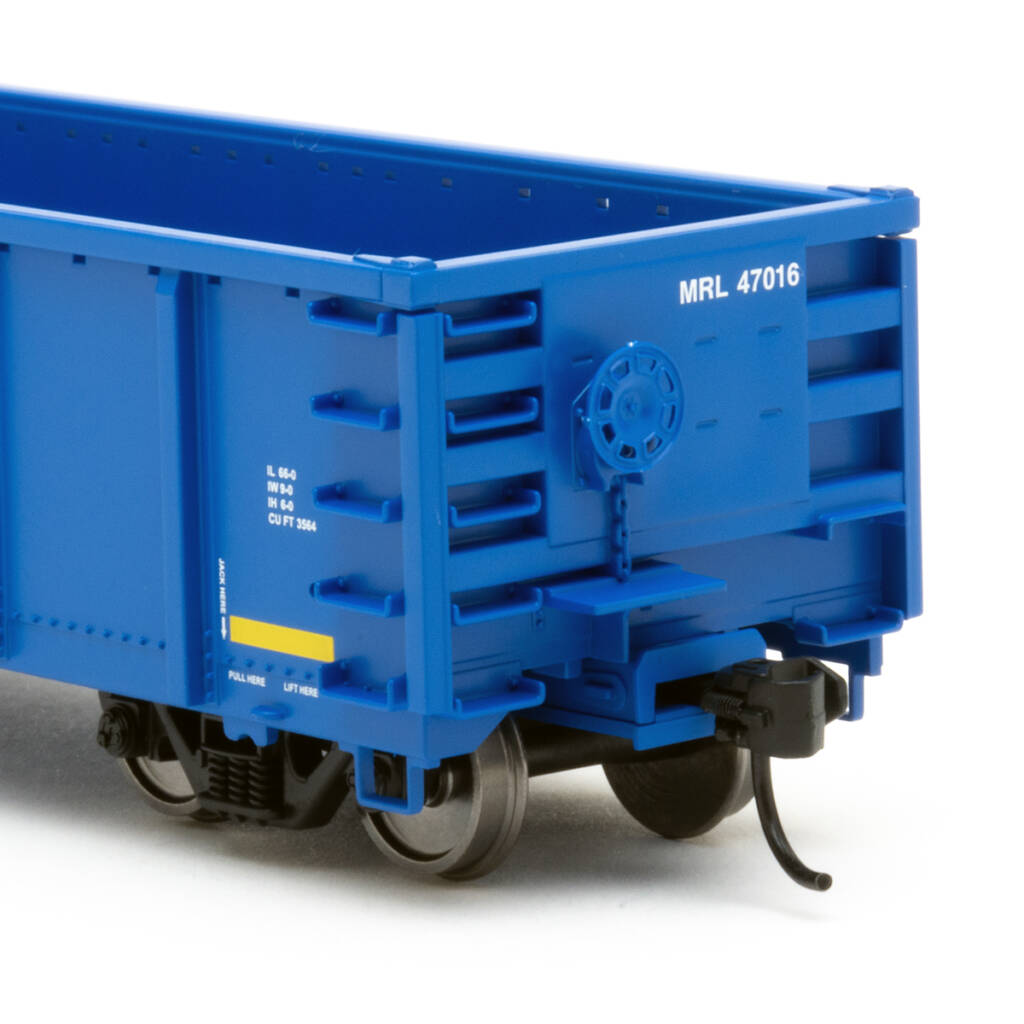 Color photo showing B end of HO scale modern gondola painted blue with red, white, and yellow graphics on white background