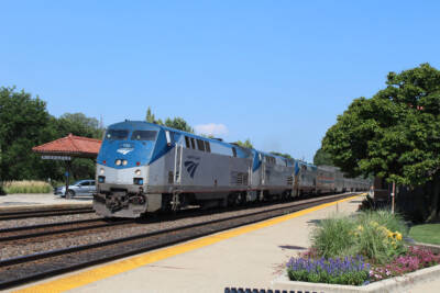 Blue and gray Amtrak passenger train. Cascades round-trips return Monday after locomotive unavailability.