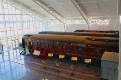 Train cars in a new museum exhibit building.