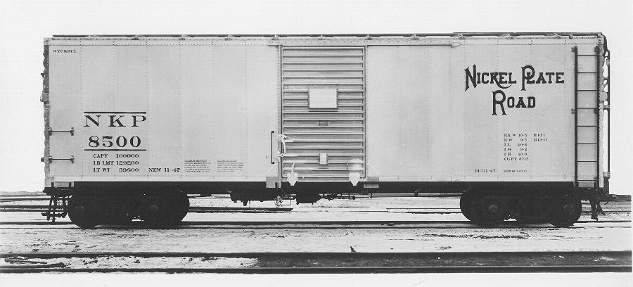 Black and white builders photo of boxcar