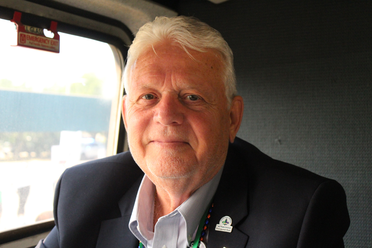 Man sitting next to window on passenger train