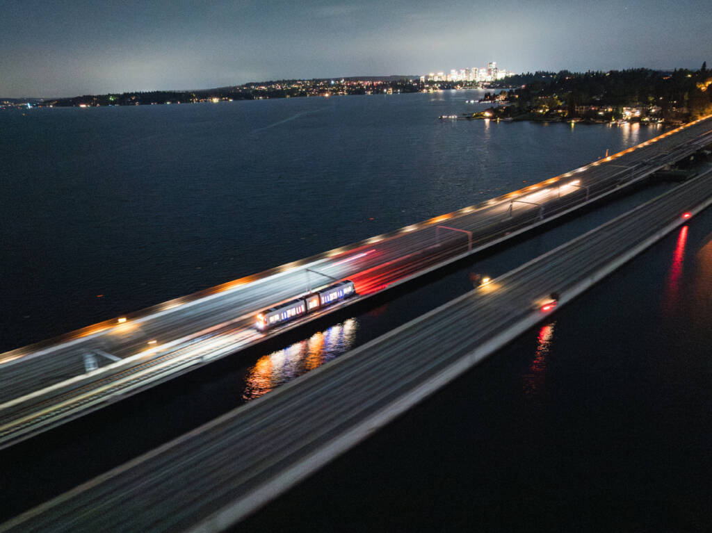 Aerial view of light rail trainset on bridge