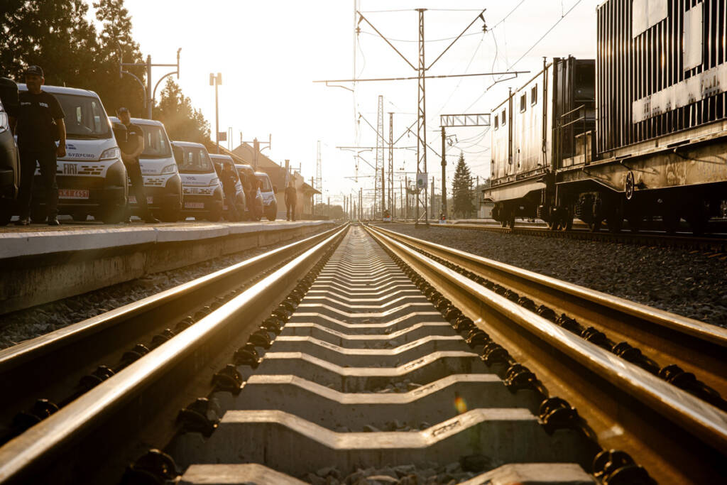 Low-angle view of dual-gauge rail line with concrete ties