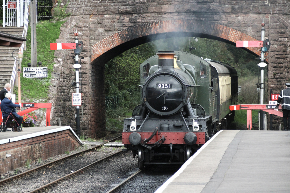 Steam locomotive arrives at station