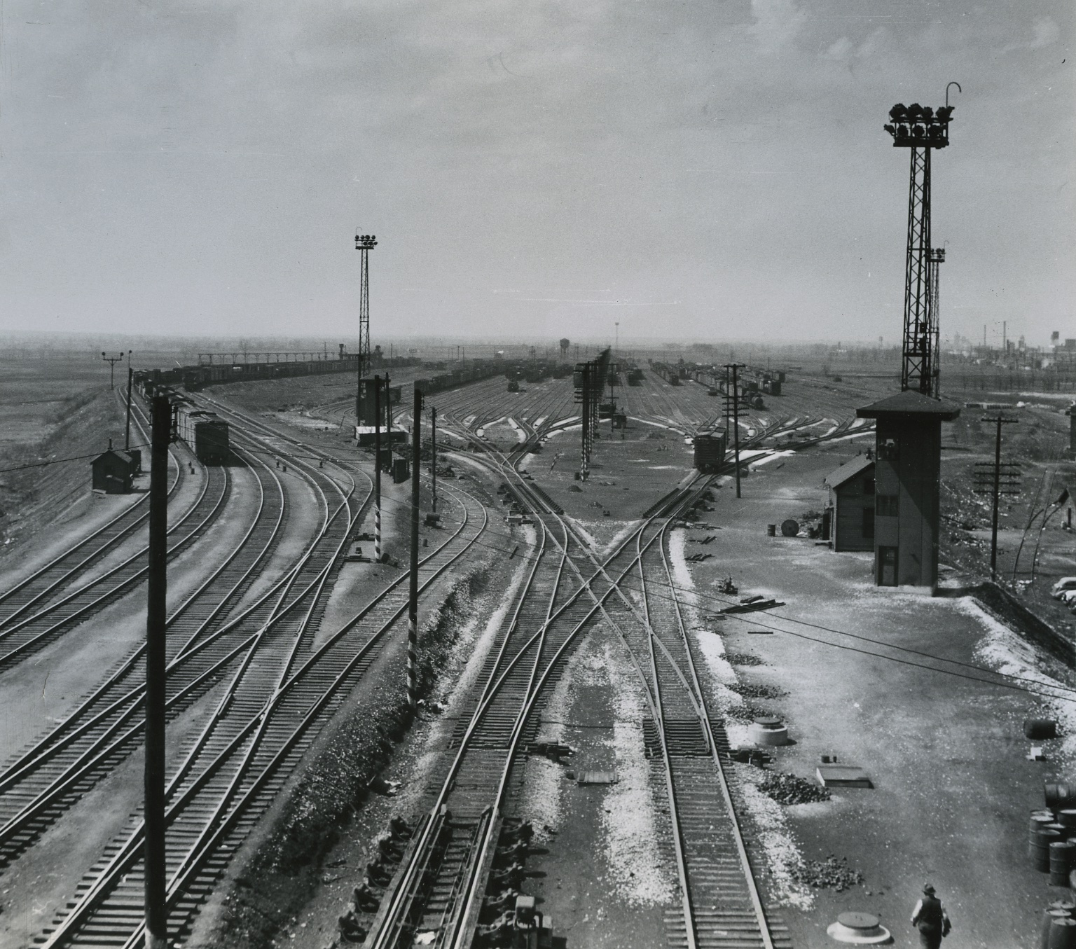 Black-and-white photo of large rail yard