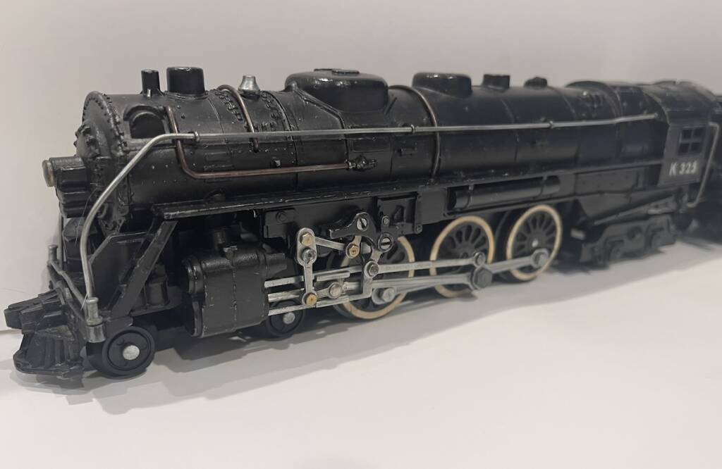 closeup of vintage black model steam locomotive