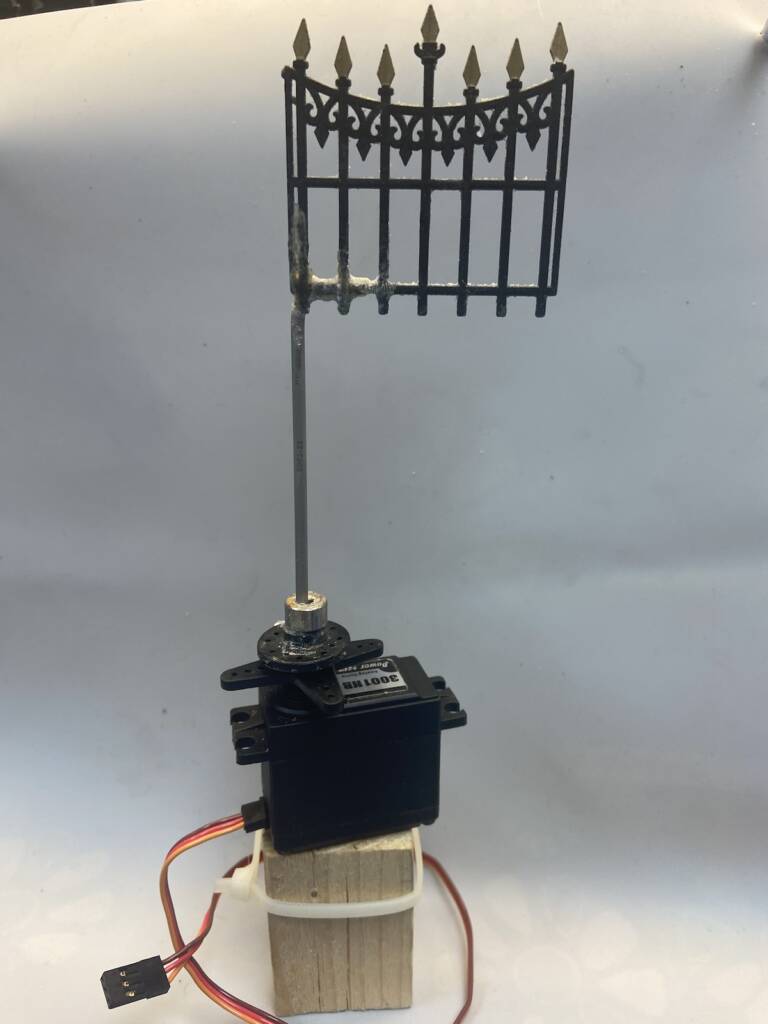 cemetery gate attached to servomotor