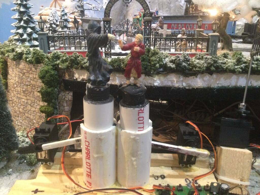 two figures with PVC pipes and servo motors