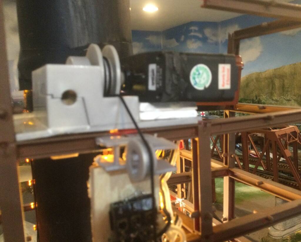 close up of servos mounted on train layout
