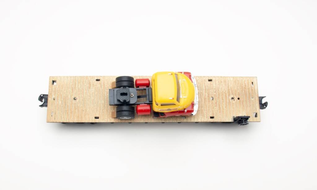 top of model flatcar with tractor