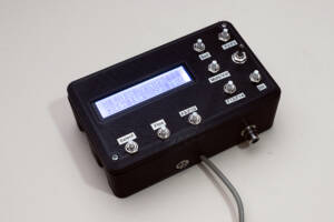 black case with LCD screen and push buttons