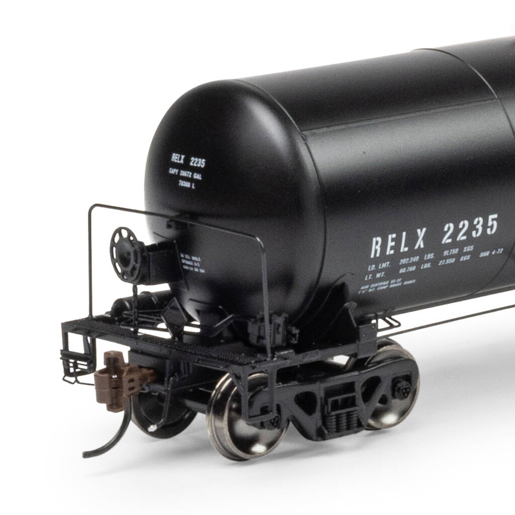 Color photo showing B end of HO scale tank car painted black with white graphics on white background