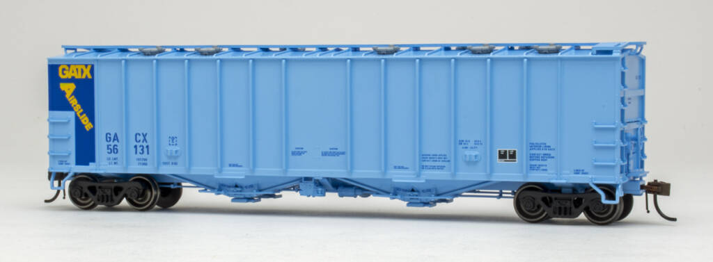Color photo of HO scale Airslide covered hopper painted two-tone blue with blue, yellow, black, and white graphics on white background 