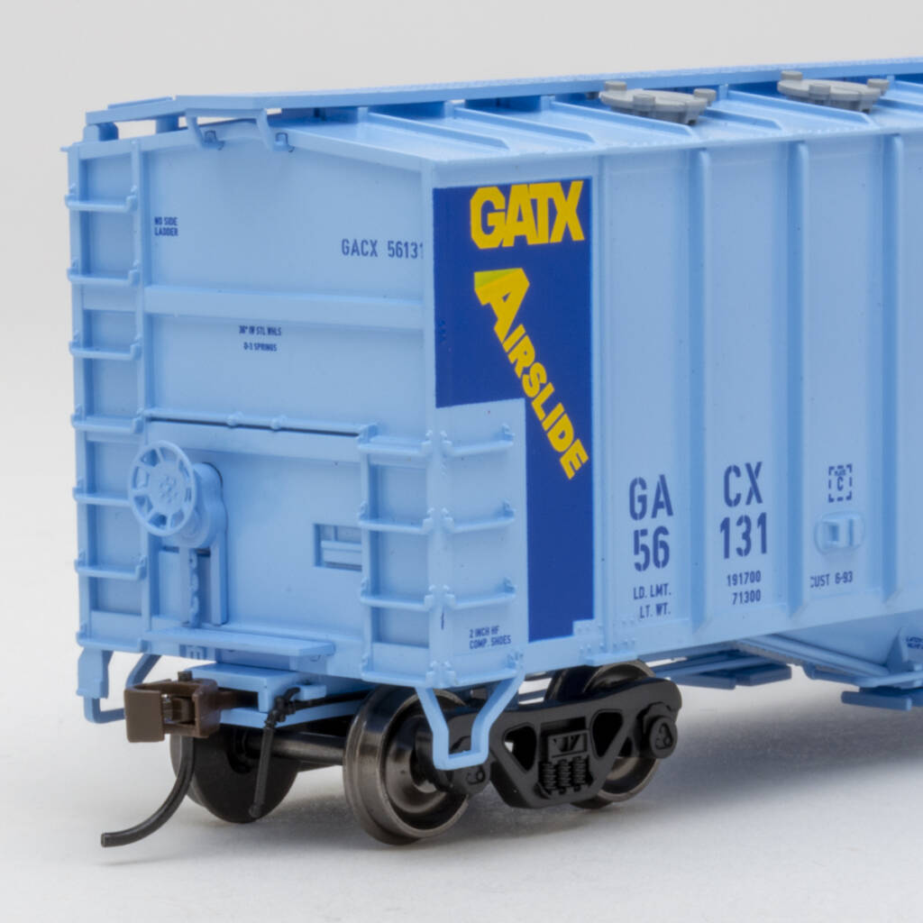 Color photo showing B end of HO scale Airslide covered hopper painted two-tone blue with blue, yellow, black, and white graphics on white background