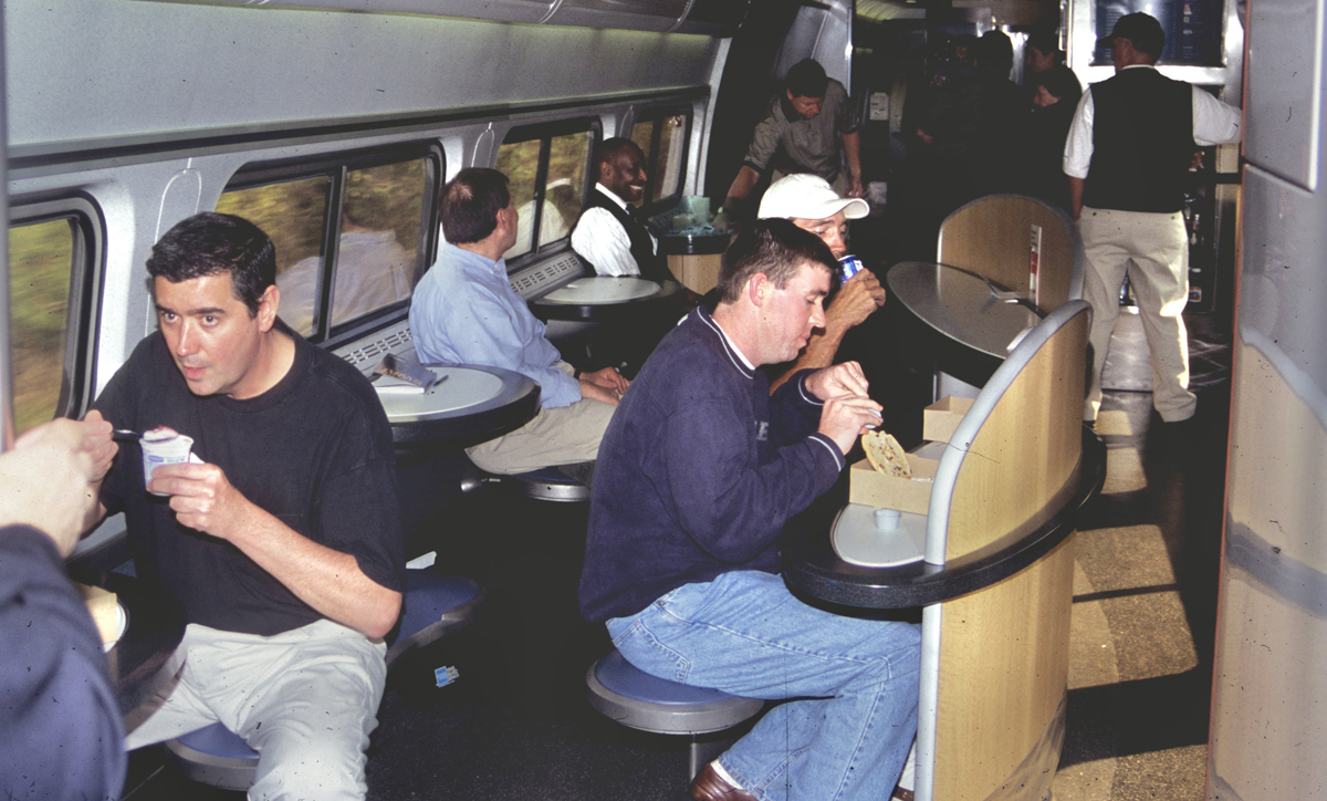 Interior of Amfleet cafe car with semicircular tables for two
